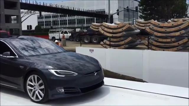 Elon Musk unveils traffic-beating car elevator